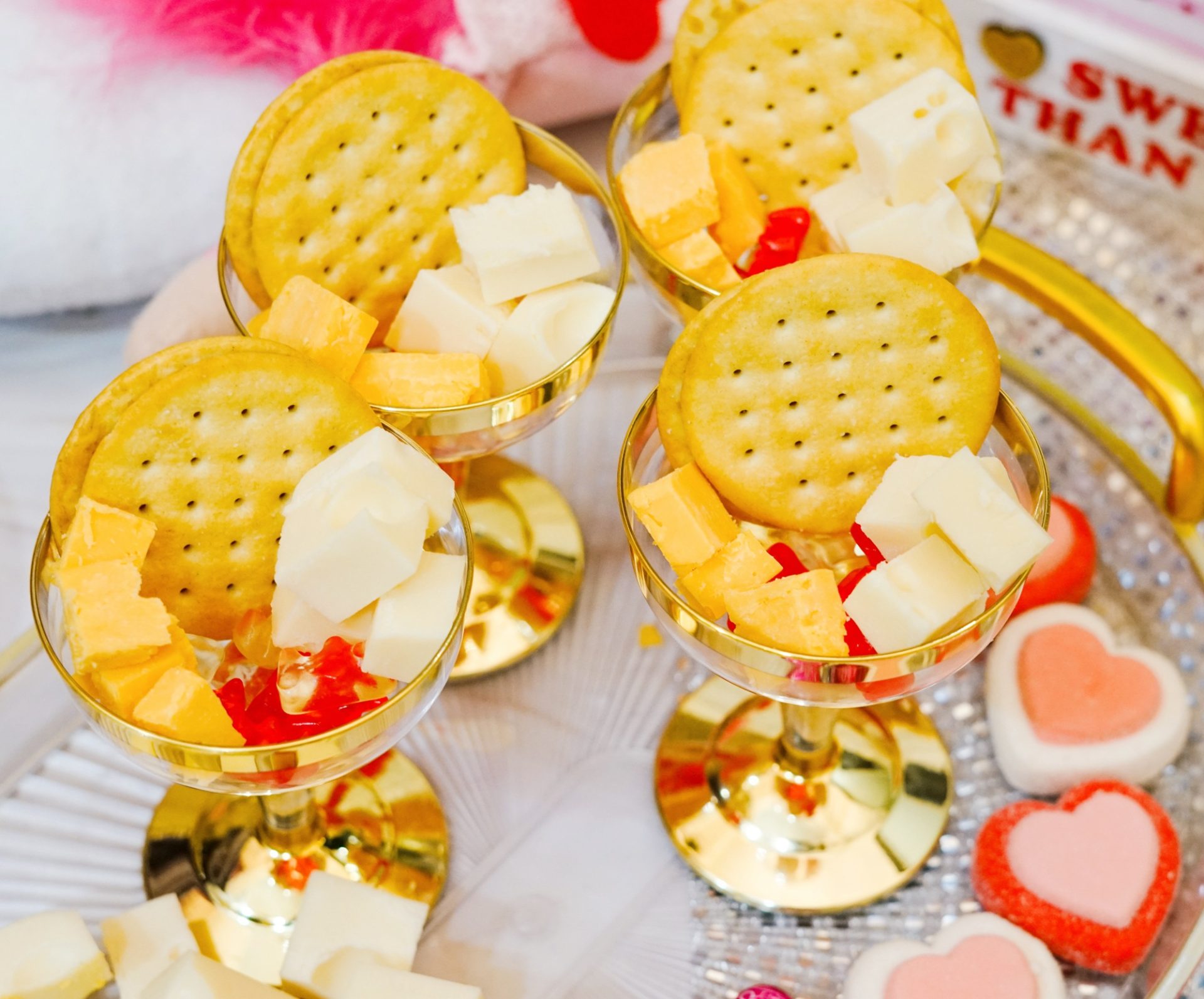 Charcuterie cups with crackers and cheese.