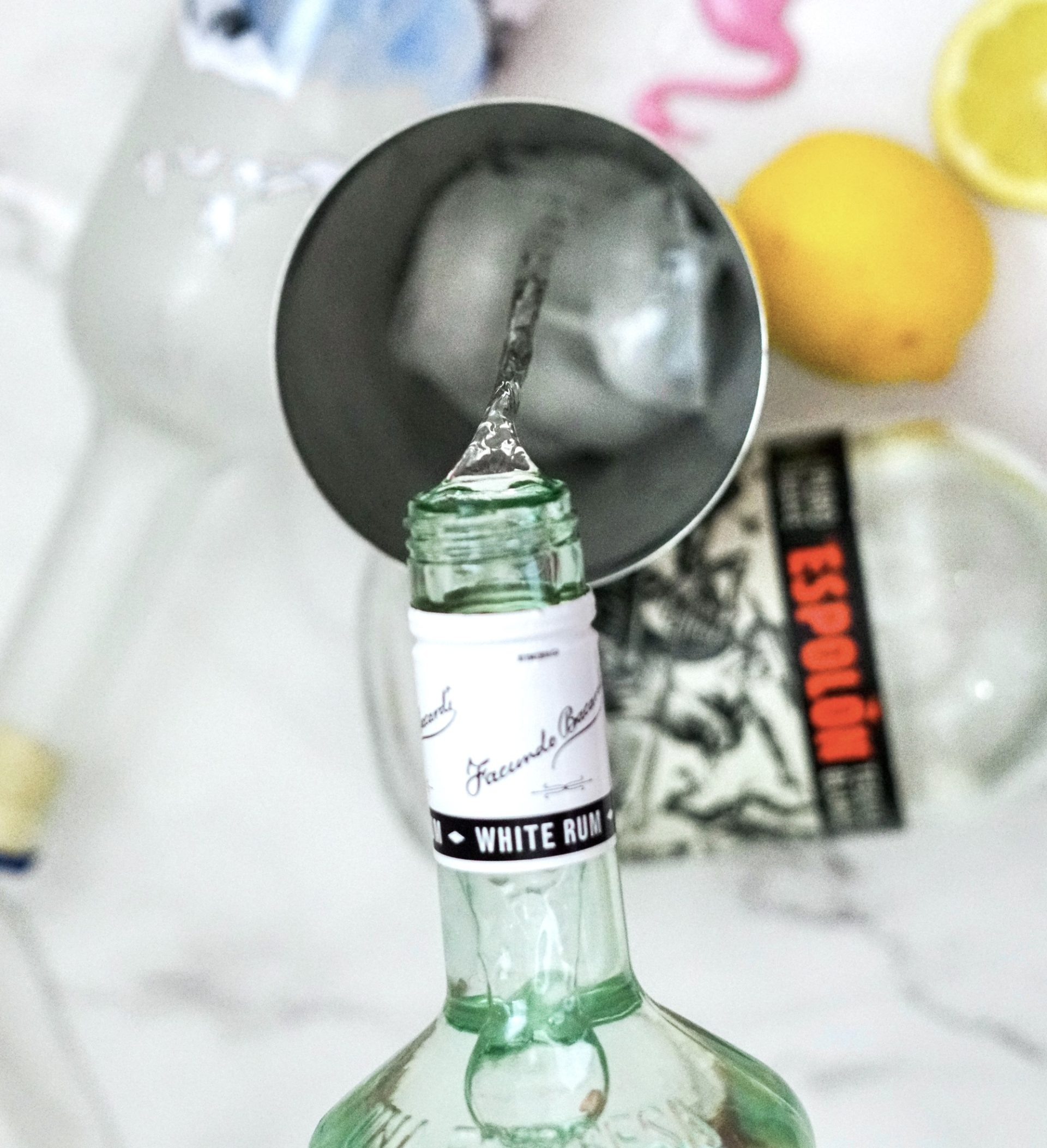 Rum being added to cocktail shaker.