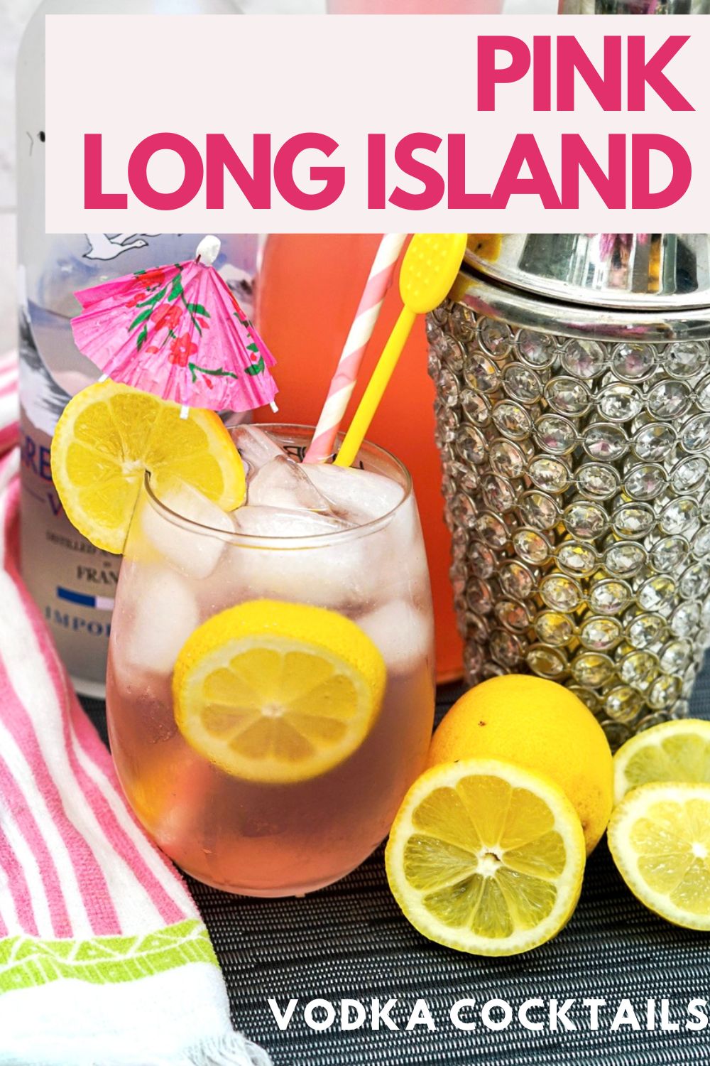 Pink Long Island Lemonade in a glass with ice and lemon slice garnish.